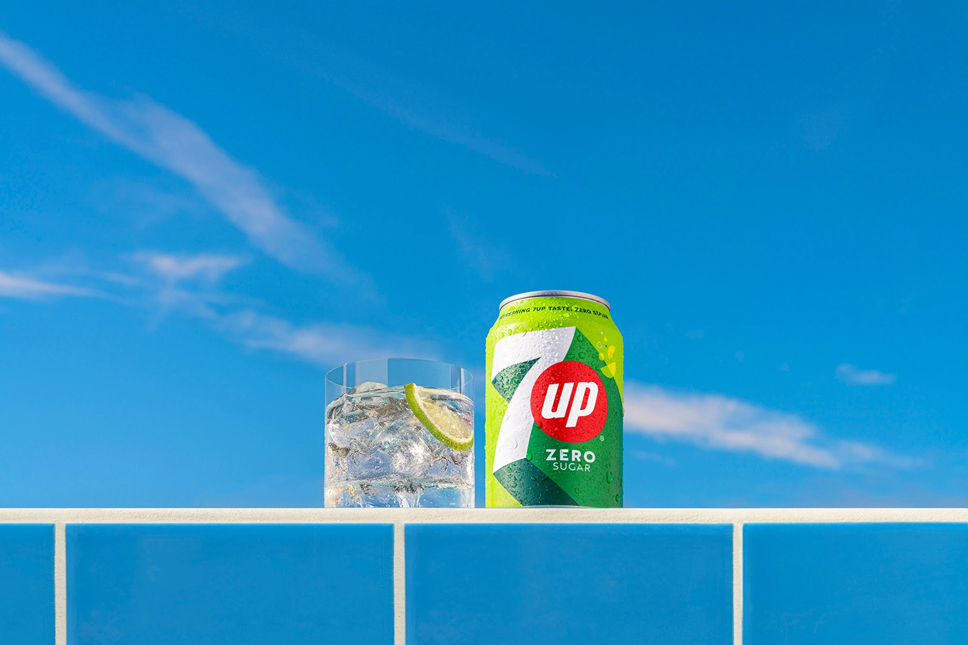 7UP can with glass on tile